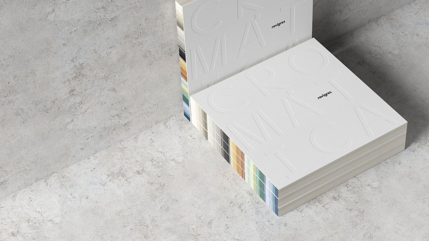 Stacked Cromática books showing colour-coded page edges