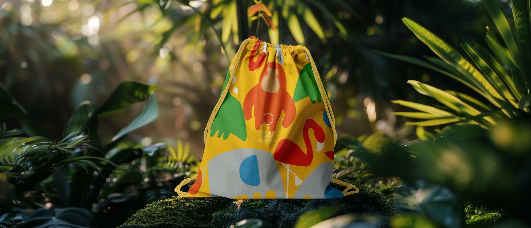 Illustrated drawstring bag on moss