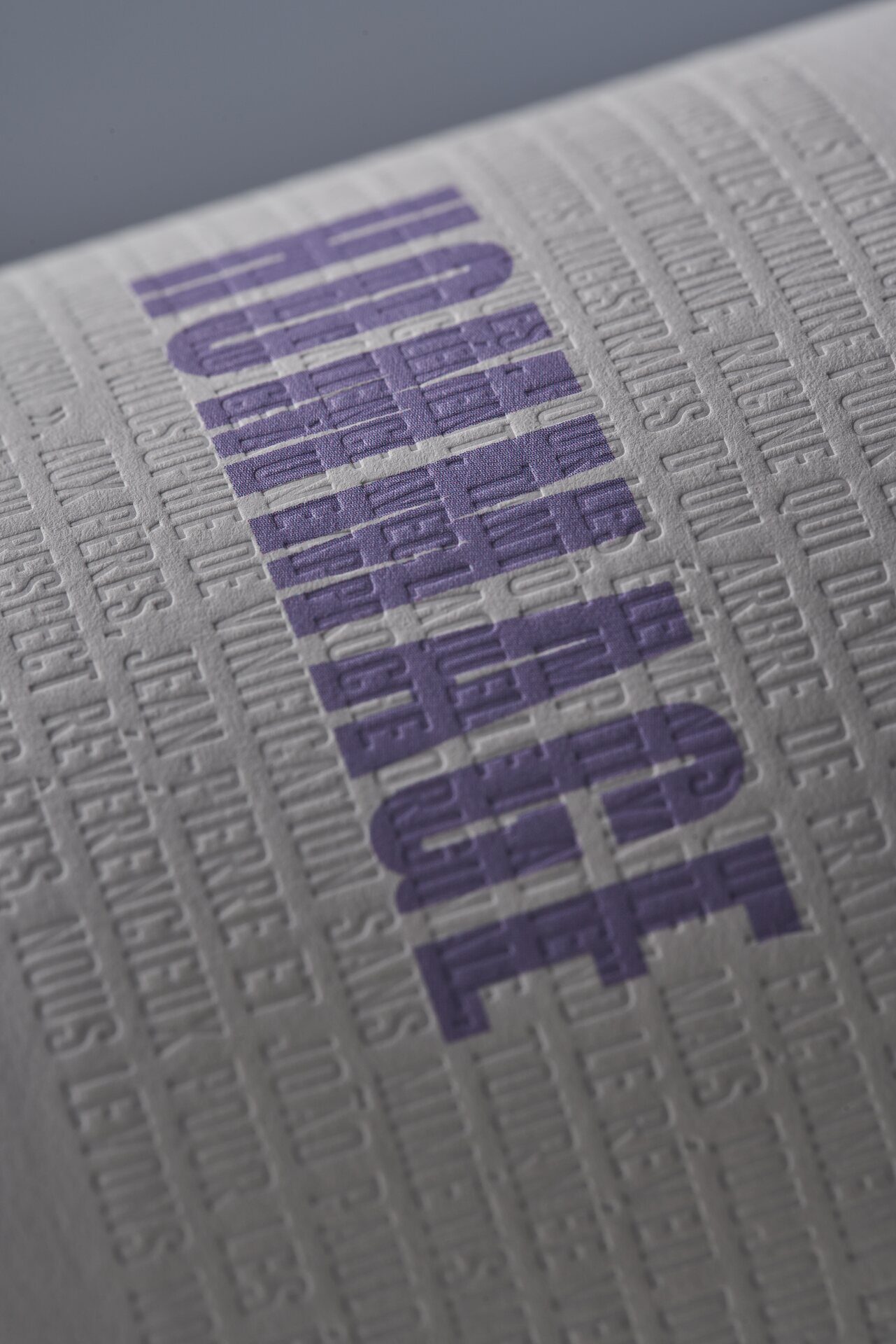 Embossed Hommage label in purple